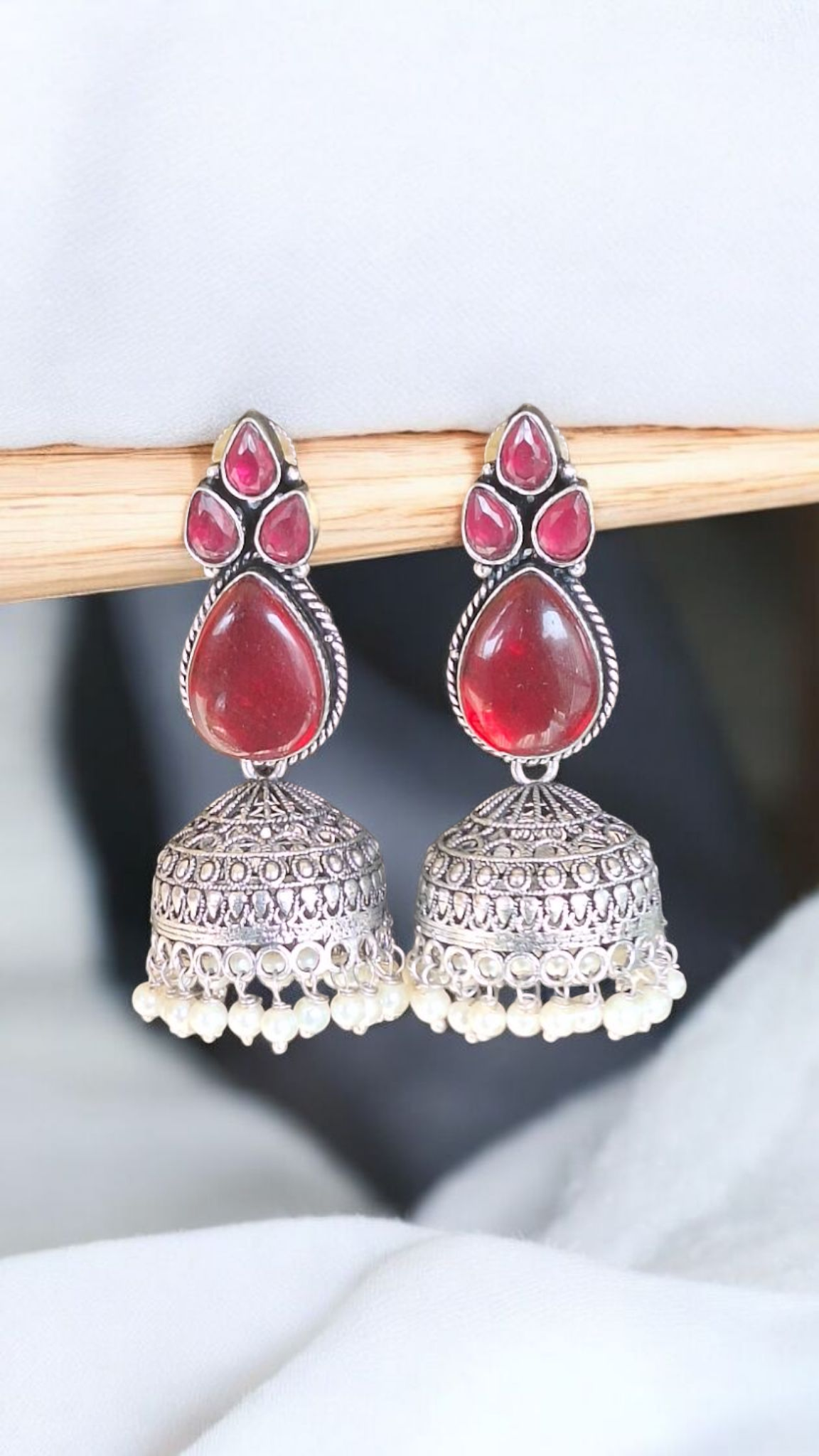 Elegant Stone Silver-Plated brass Jhumka Earrings with Pearl Detailing