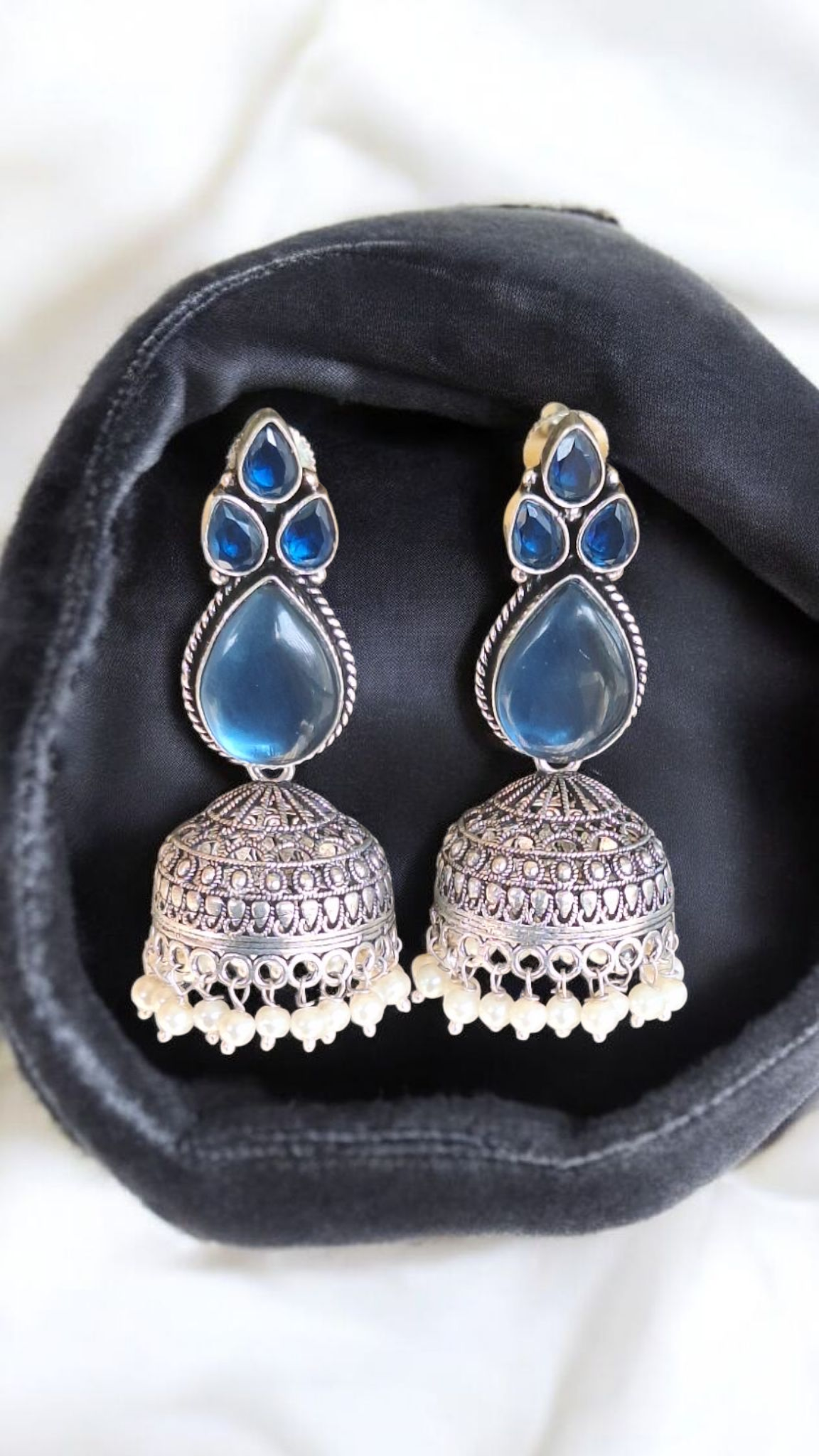 Elegant Stone Silver-Plated brass Jhumka Earrings with Pearl Detailing