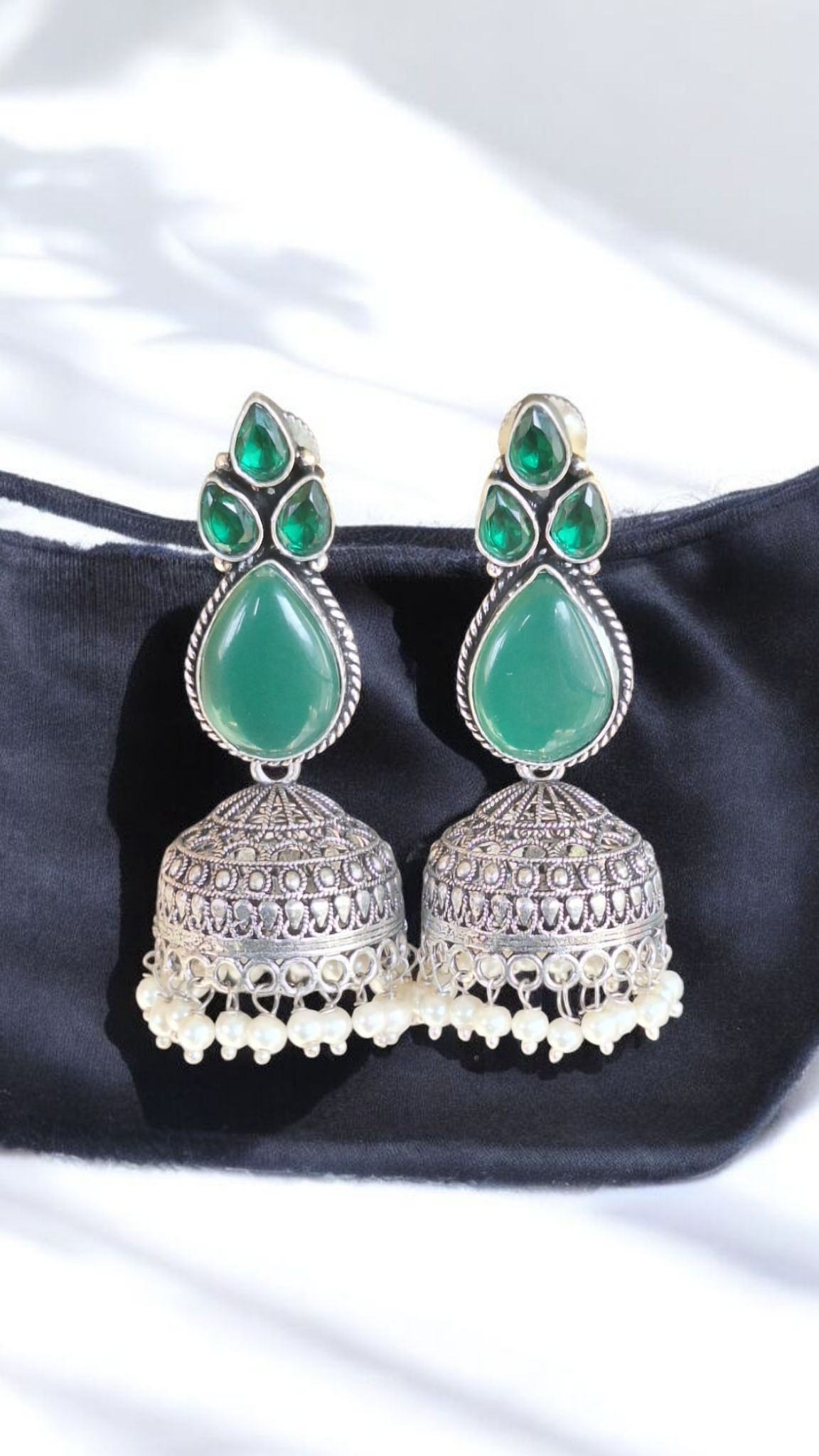 Elegant Stone Silver-Plated brass Jhumka Earrings with Pearl Detailing