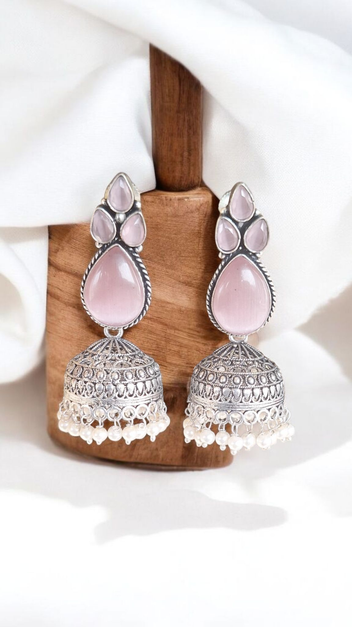 Elegant Stone Silver-Plated brass Jhumka Earrings with Pearl Detailing