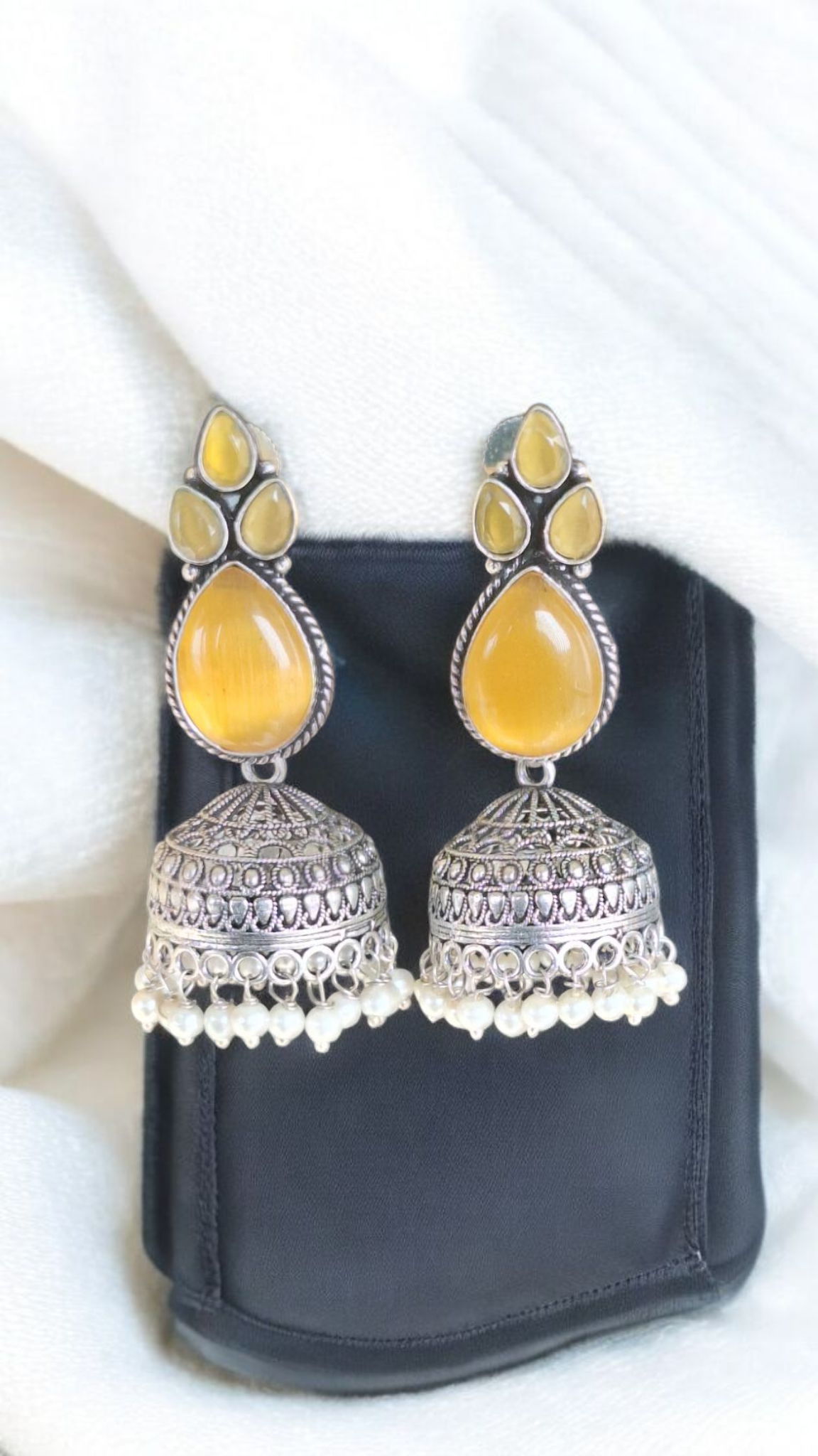Elegant Stone Silver-Plated brass Jhumka Earrings with Pearl Detailing