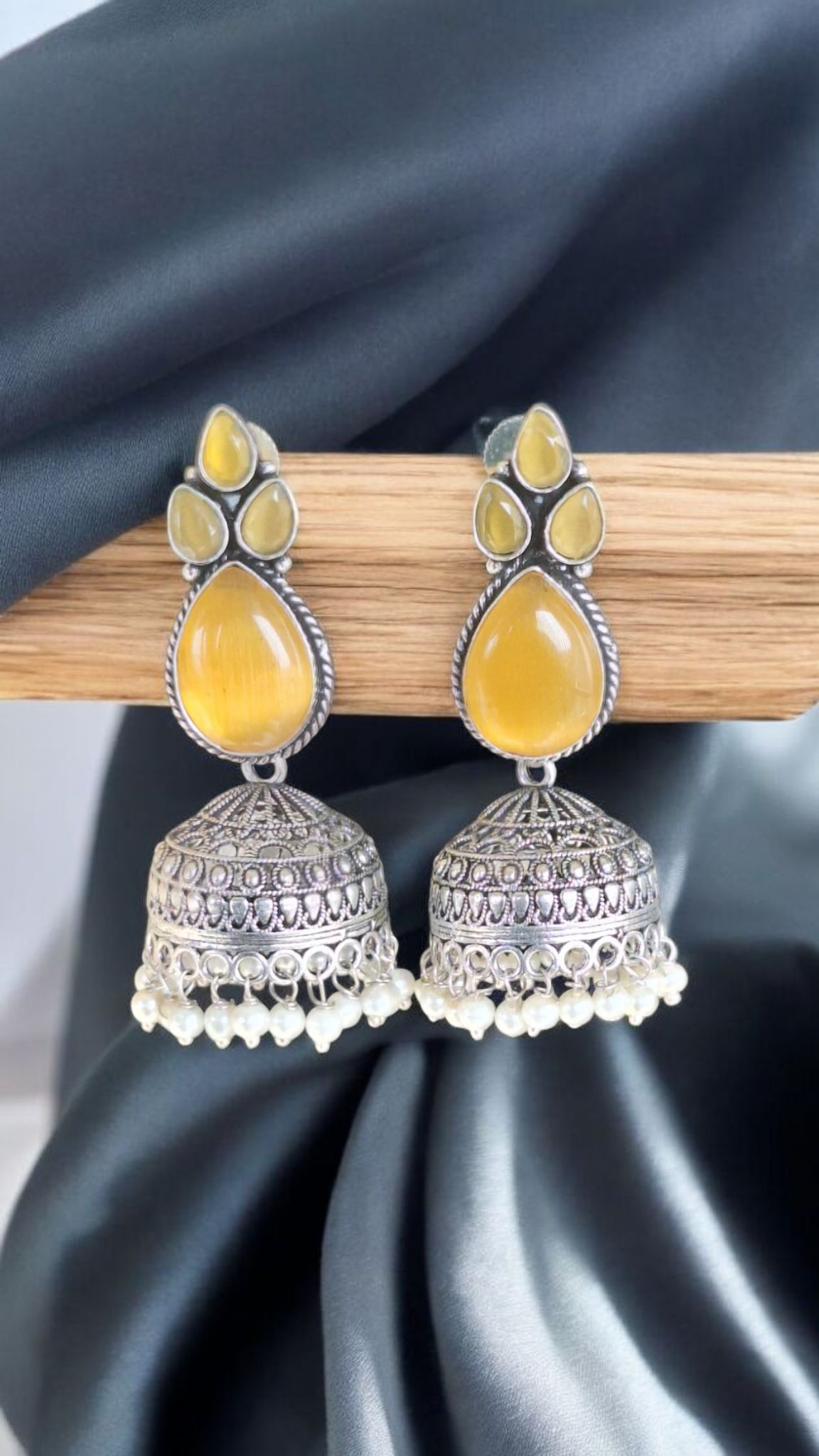 Elegant Stone Silver-Plated brass Jhumka Earrings with Pearl Detailing