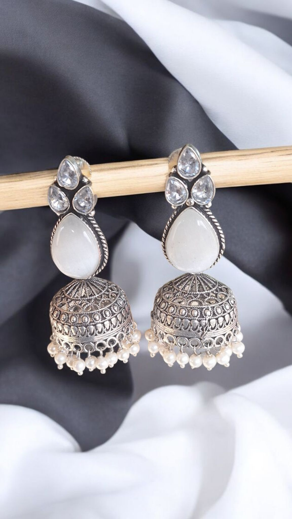 Elegant Stone Silver-Plated brass Jhumka Earrings with Pearl Detailing