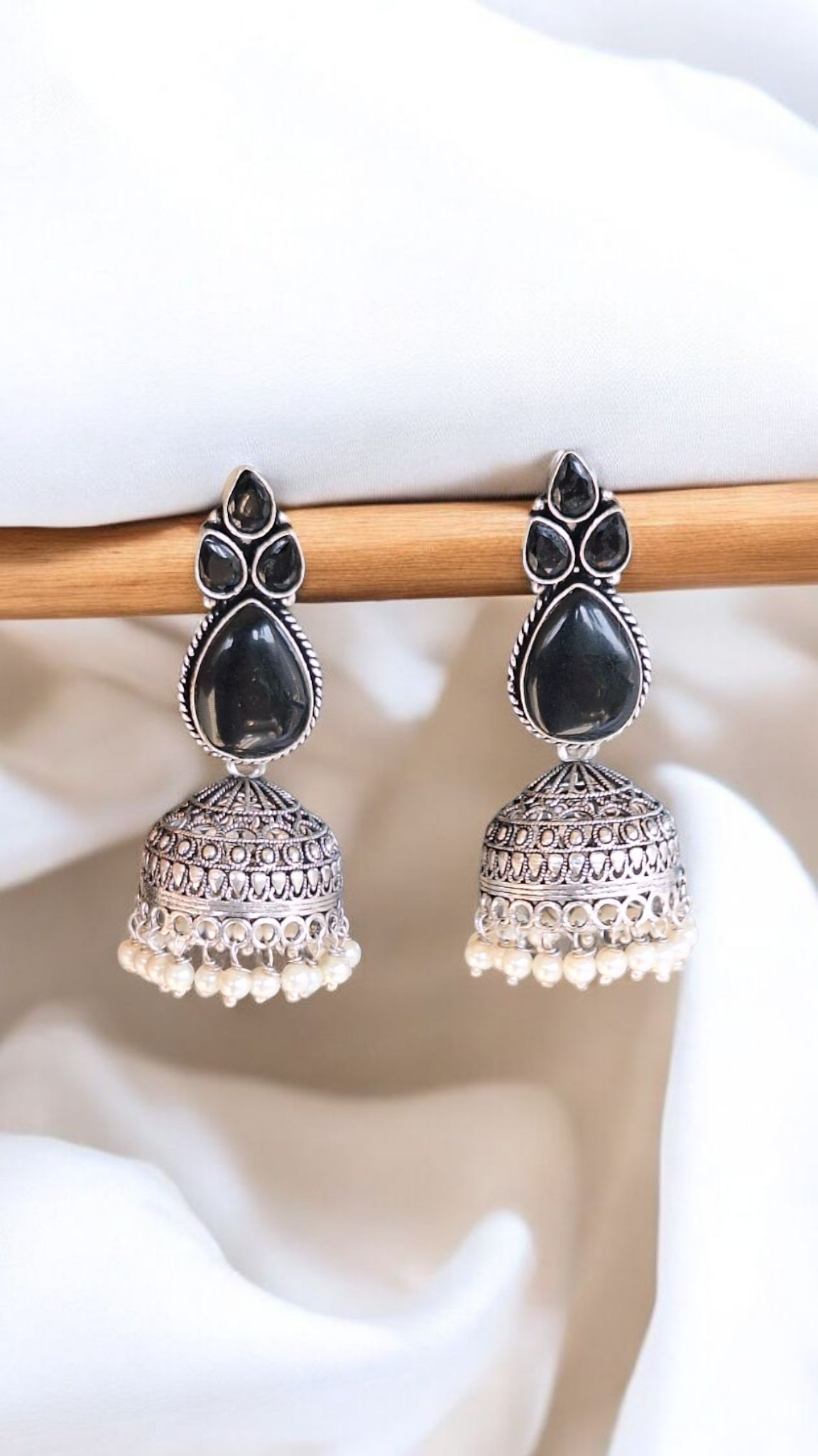 Elegant Stone Silver-Plated brass Jhumka Earrings with Pearl Detailing